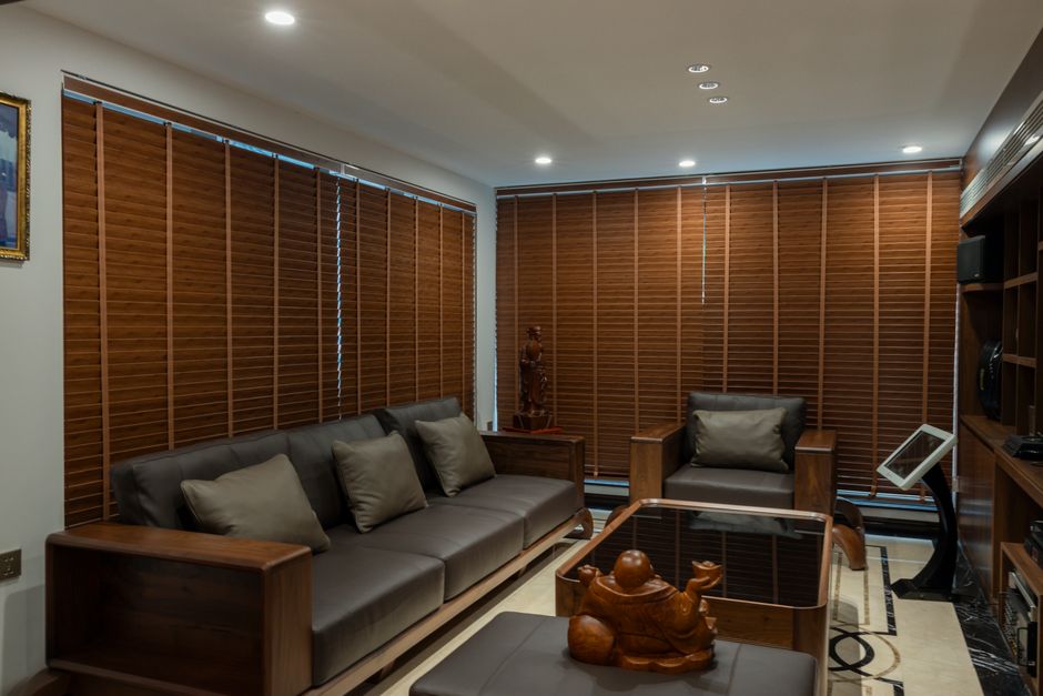Modern living room interior with sleek custom window shades providing elegant light filtering